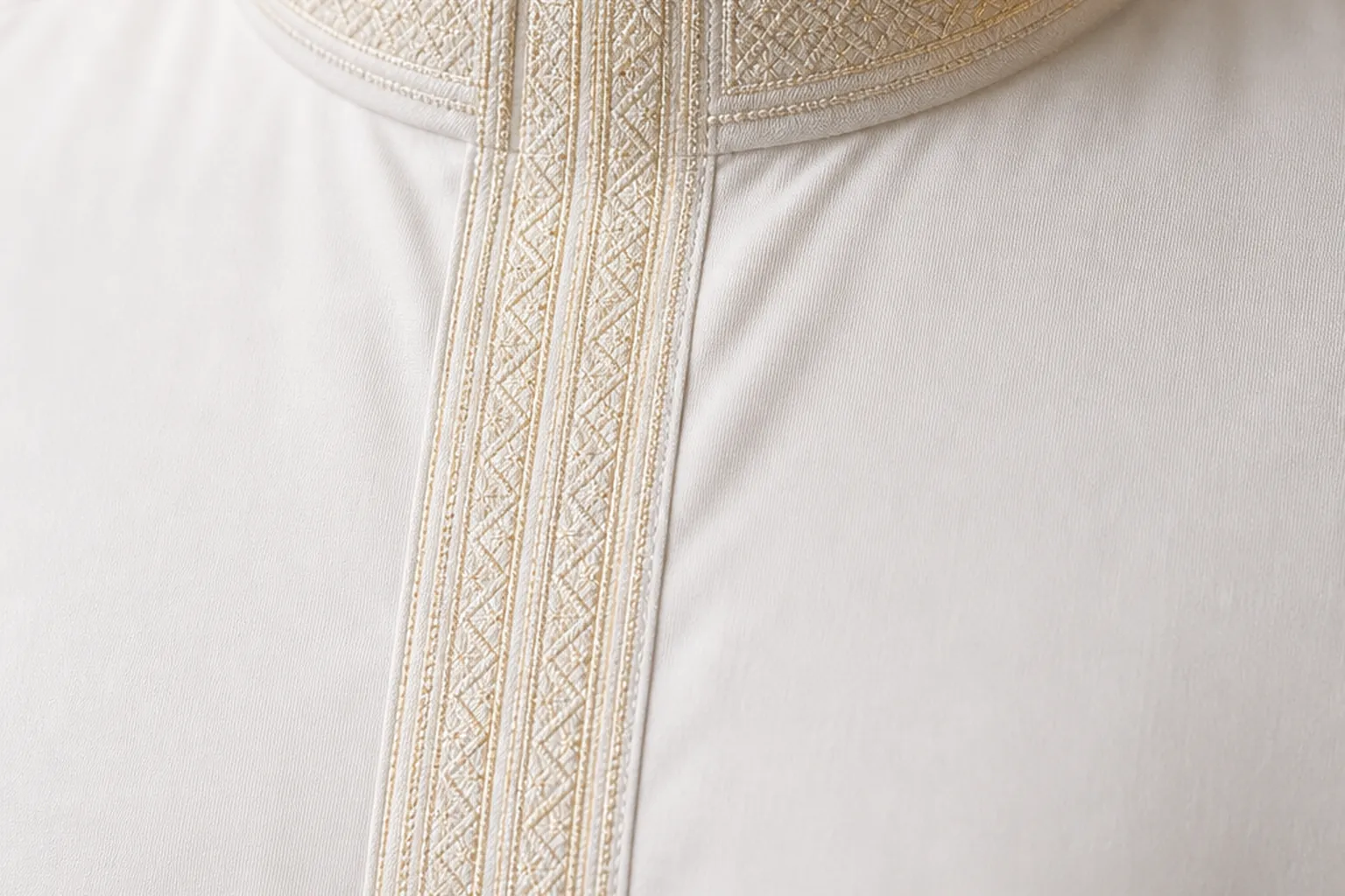 Traditional thobe neckline with fine tonal ivory and pale gold embroidery